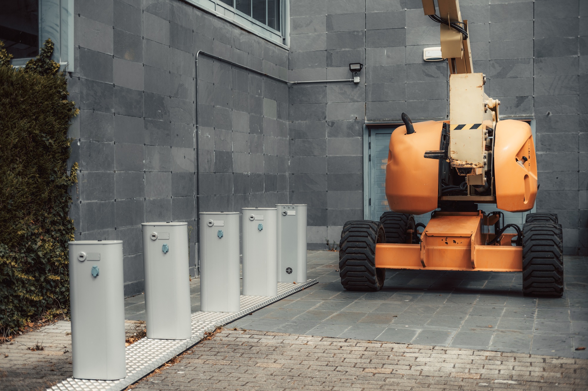 Orange cherry picker, utility boxes